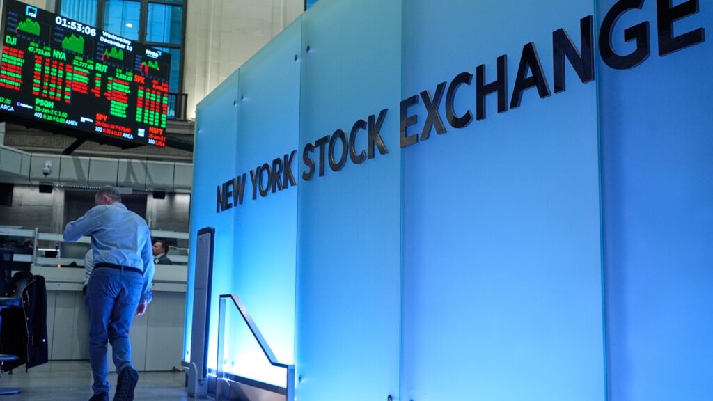 Economic indicators are mixed, with Wall Street nearing record highs