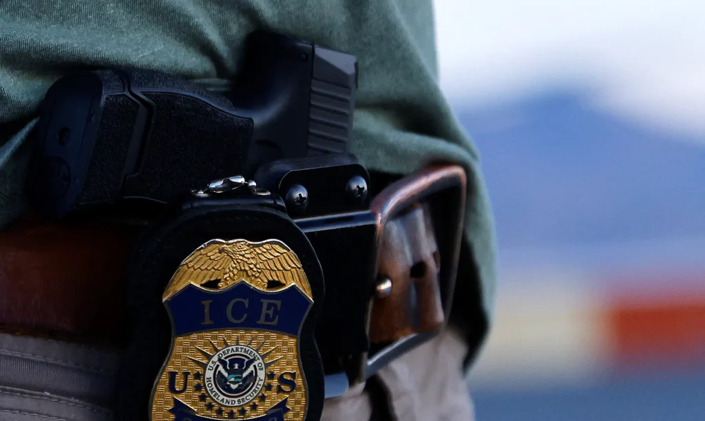 ICE officer arrested on suspicion of shooting Venezuelan man during US immigration raid | Civil Rights News
