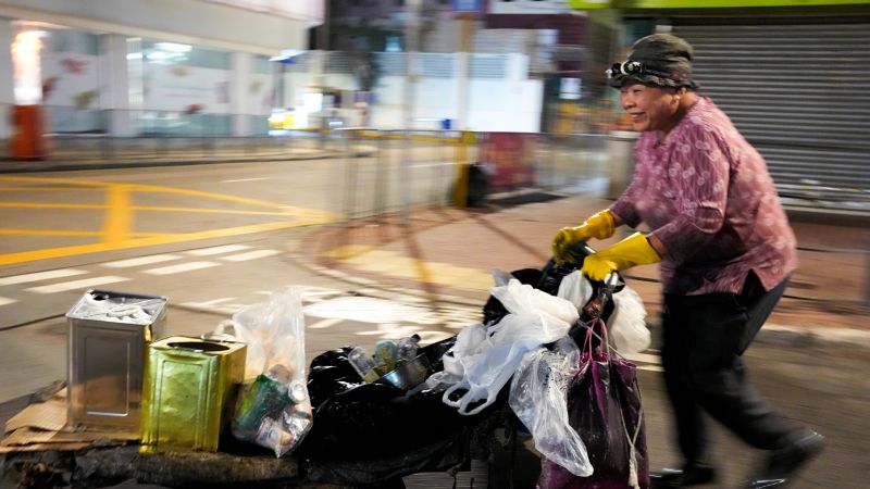 In a city full of skyscrapers, “Cardboard Granny” collects waste and earns cash