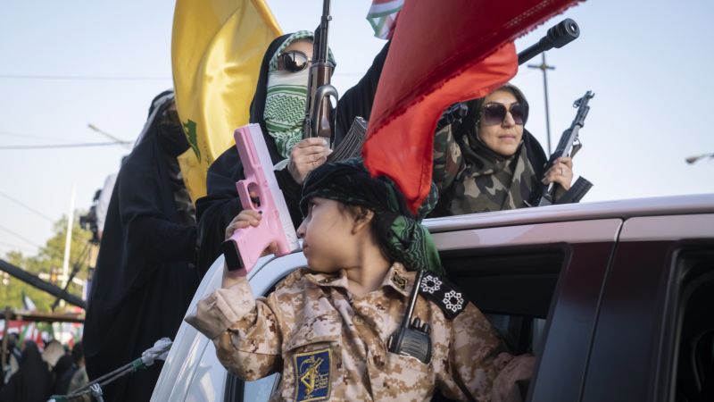 Guns are shown on TV and in the streets of Iran as President Trump threatens war again