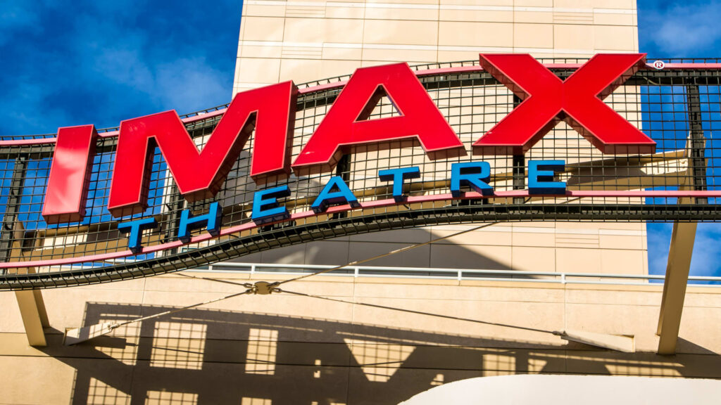 How does IMAX make money from movie theaters it doesn’t own?