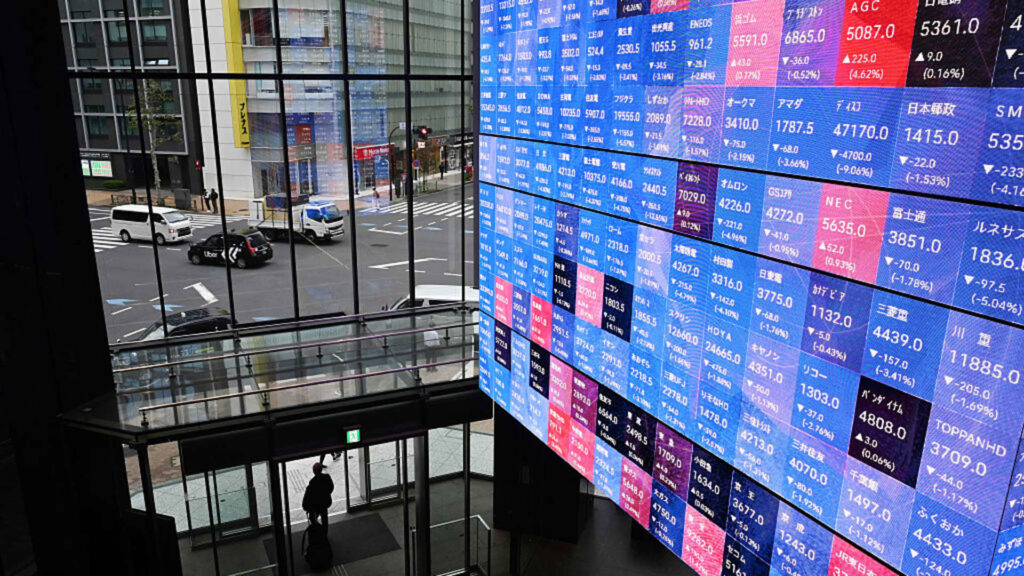 Japanese stocks rise on bond yields and weaker yen after interest rate hike